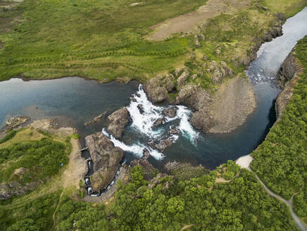 Aerial top view of Glanni waterfall with fish ladder in Nordura river, Vesturland, Iceland. - AAEF27823