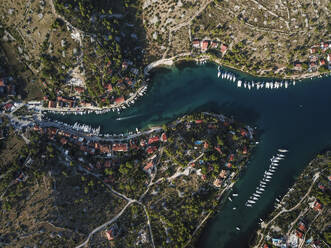 Aerial view of Brac Island coastline with boats in the bay, Croatia. - AAEF27849