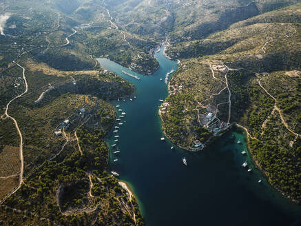 Aerial view of Brac Island bay with clear turquoise waters and boats, Brac Island, Croatia. - AAEF27854