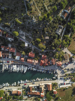 Aerial view of boats in a beautiful bay with a stunning coastline and harbour, Brac Island, Croatia. - AAEF27862