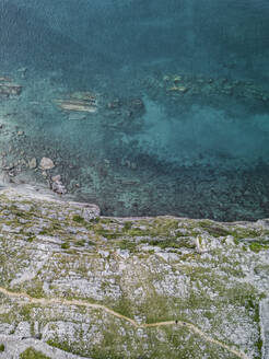 Aerial view of clear turquoise water and pebble coastline on Coki Baska Island, Adriatic Sea, Croatia. - AAEF27878