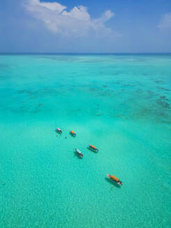 Aerial view of people with traditional fishing boat in Zanzibar, Tanzania. - AAEF27886