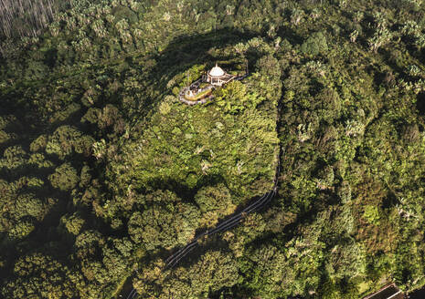 Aerial drone view of Ganga Talao, a Hindu pilgrimage site with a temple on a hill at early morning, Grand Bassin, Savanne, Mauritius. - AAEF27930