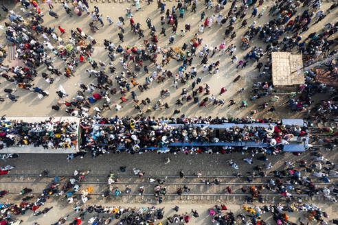 Aerial view of crowded train station with people celebrating festival, Dhaka Division, Bangladesh. - AAEF28020