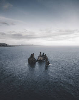 Aerial view of Reynisdrangar sea stacks near Vik, Iceland. - AAEF28074