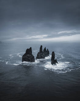 Aerial view of Reynisdrangar sea stacks near Vik, Iceland. - AAEF28077