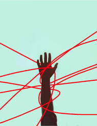 Hand of unrecognizable person tangled in red strings against colored background - GWAF00527