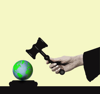 Planet earth under oversized judge's gavel against yellow background - GWAF00529