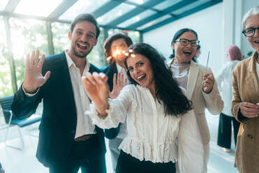 Businessmen and businesswomen making a corporate party after the business conference to celebrate the year goals and achievements. - DMDF11270