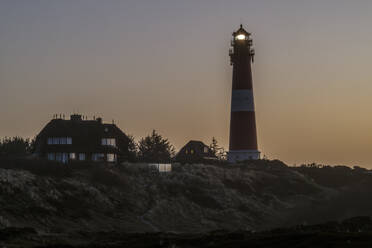 Germany, Schleswig-Holstein, Hornum, Lighthouse on Sylt island at dawn - KEBF02851