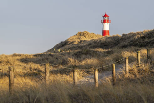 Germany, Schleswig-Holstein,Germany, Schleswig-Holstein, List, Beach footpath with List Ost lighthouse in background - KEBF02862