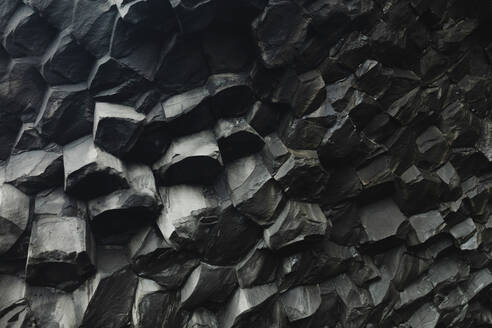 Close-up view of natural hexagonal basalt columns, showcasing Iceland's unique geology. - ADSF53345