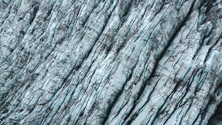 Stunning close-up of the blue ice and crevasses of a glacier in Iceland, showcasing nature's artistry. - ADSF53360