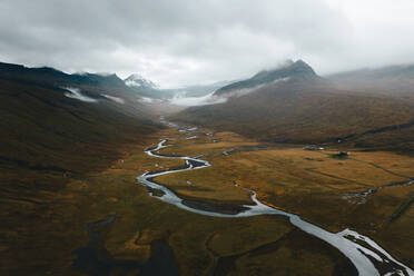 Majestic view of a winding river through an expansive valley in Iceland's rugged landscape. - ADSF53366