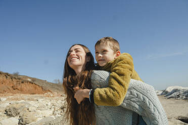 Happy woman having fun with son at sunny day - KVBF00075