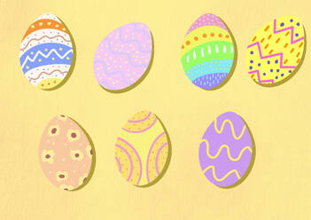 Colorful Easter eggs against yellow background - EGHF00903