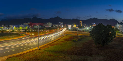 View of trail lights and city skyline in Port Louis at dusk, Port Louis, Mauritius, Indian Ocean, Africa - RHPLF32295