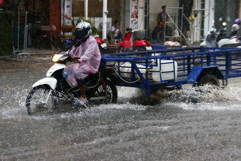 Heavy rain and water logging on road during Monsoon season, Phnom Penh, Cambodia, Indochina, Southeast Asia, Asia - RHPLF32391