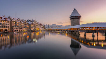 Kapellbrucke (Chapel Bridge) at sunrise in winter, wooden footbridge, Lucerne, Switzerland, Europe - RHPLF33392