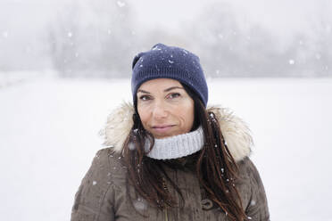 Woman under a snowfall, Milan, Italy - ISF26275