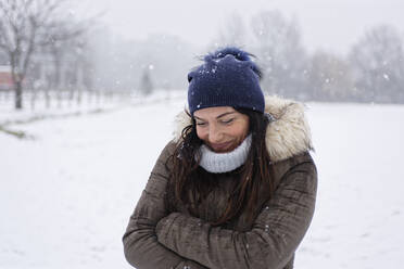 Woman under a snowfall, Milan, Italy - ISF26278