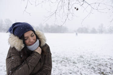 Woman under a snowfall, Milan, Italy - ISF26280