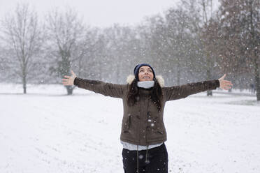 Woman under a snowfall, Milan, Italy - ISF26284
