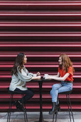 Madrid, Spain. Two friends having fun in the city. - PNAF06104