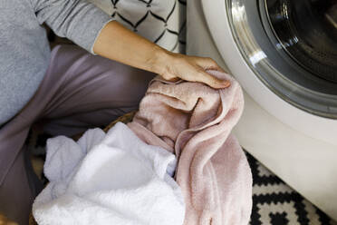 Woman doing laundry at home - TYF00811