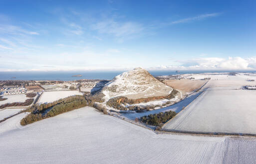UK, Scotland, North Berwick, Aerial view of North Berwick Law hill and surrounding fields in winter - SMAF02749