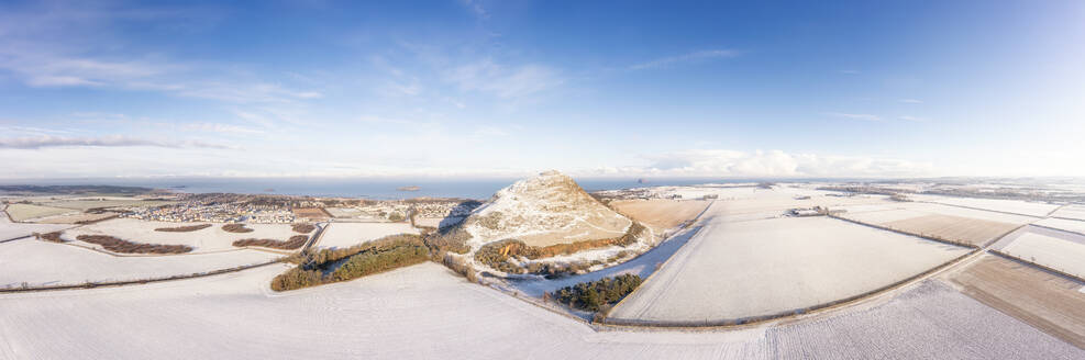 UK, Scotland, North Berwick, Aerial panorama of North Berwick Law hill and surrounding fields in winter - SMAF02750