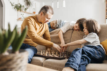 dad and son play chess - ELMF00147