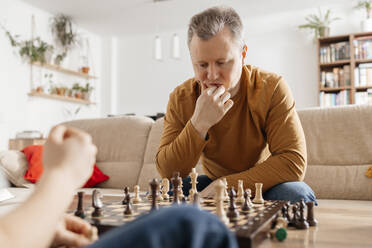 dad and son play chess - ELMF00150