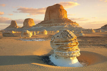 Limestone rock formations in white sand Sahara desert at sunset, Egypt - DSGF02542