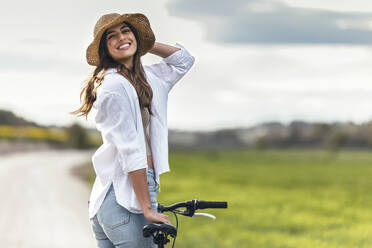 Woman cycling outdoors, Barcelona, Spain - JSRF02953