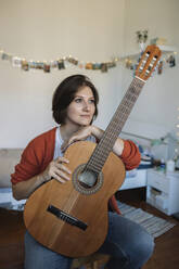 girl with a guitar at home - MCHF00036