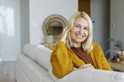 UAE, a woman resting on the sofa - TYF00824