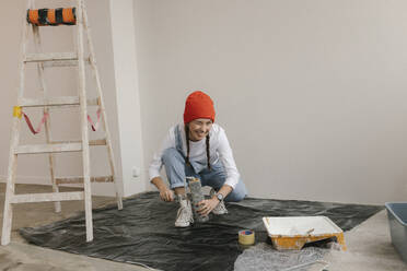Gdansk, Poland, woman making renovations in her new apartment and dreams - VIVF01261