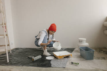 Gdansk, Poland, woman making renovations in her new apartment and dreams - VIVF01264
