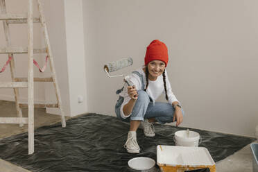 Gdansk, Poland, woman making renovations in her new apartment and dreams - VIVF01265