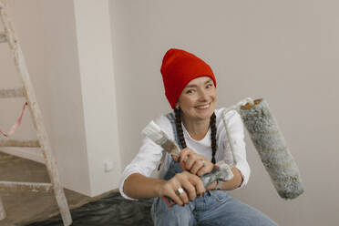 Gdansk, Poland, woman making renovations in her new apartment and dreams - VIVF01266