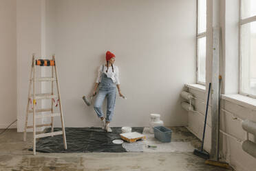 Gdansk, Poland, woman making renovations in her new apartment and dreams - VIVF01267