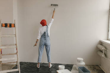 Gdansk, Poland, woman making renovations in her new apartment and dreams - VIVF01268