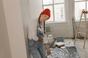 Gdansk, Poland, woman making renovations in her new apartment and dreams - VIVF01269