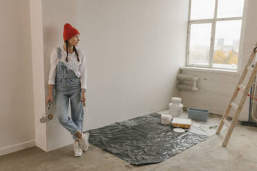 Gdansk, Poland, woman making renovations in her new apartment and dreams - VIVF01270