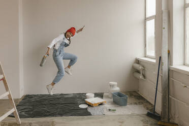 Gdansk, Poland, woman making renovations in her new apartment and dreams - VIVF01272