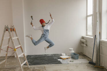 Gdansk, Poland, woman making renovations in her new apartment and dreams - VIVF01273