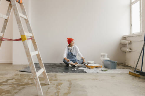 Gdansk, Poland, woman making renovations in her new apartment and dreams - VIVF01279