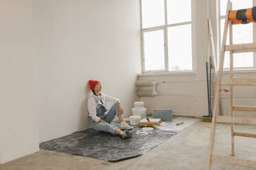 Gdansk, Poland, woman making renovations in her new apartment and dreams - VIVF01280