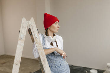 Gdansk, Poland, woman making renovations in her new apartment and dreams - VIVF01282